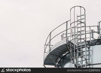 Industrial metal ladder with round protection, railing. Safety rules, agricultural industry objects details.. Industrial metal ladder with round railing