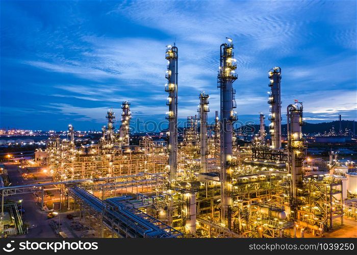 industrial oil and gas LPG refinery industry and commercial storage facilities import and export international by sea transport vessels aerial view at night in Thailand