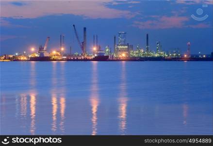 Industrial Petrochemical plant and sea in night time