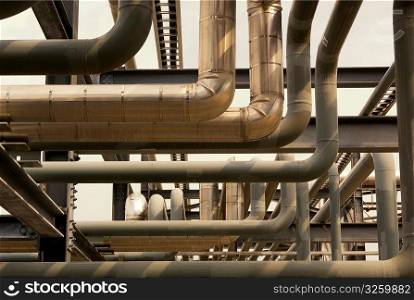 Industrial pipes and duct-work flowing in various directions.