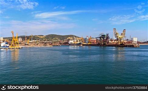 industrial port in Piombino from the sea, Tuscany, Italy