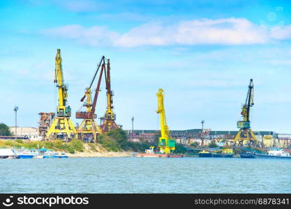 Industrial port on Danube river in the day. Romania