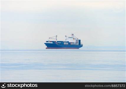 Industrial ship full of containers in the sea