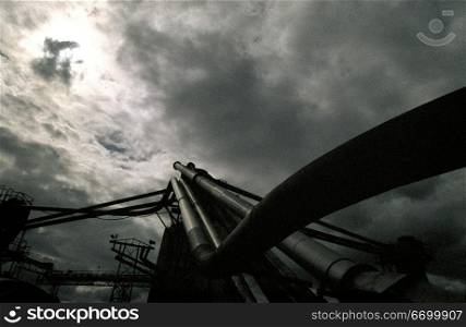 Industrial Structures Under A Dark Gray Sky