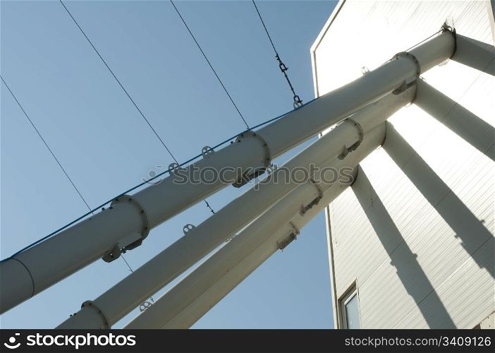 Industrial tubes connected to building for mixing concrete. Horisontal image
