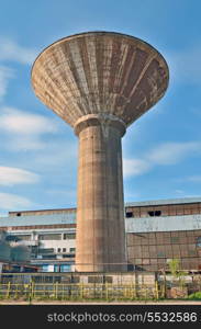 industrial water tower inside of plant