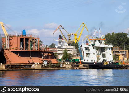 Industrial waterfront at the Gdansk (Danzig) dockyard in Poland, view from the river Motlawa