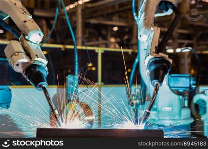 Industrial welding robots are movement welding in production line