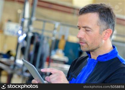 Industrial worker using tablet