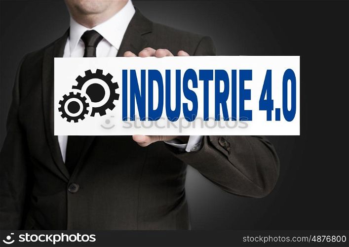 industrie 4.0 in german industry sign is held by businessman. industrie 4.0 in german industry sign is held by businessman.