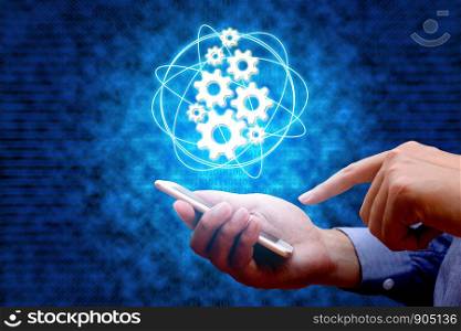 Industry 4.0, industrial internet of things concept with man using smart phone and binary background.