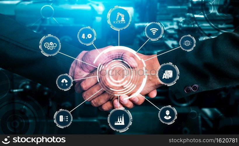 Industry 4.0 technology concept - Smart factory for fourth industrial revolution with icon graphic showing automation system by using robots and automated machinery controlled via internet network .. Industry 4.0 technology concept - Smart factory for fourth industrial revolution