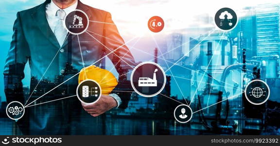 Industry 4.0 technology concept - Smart factory for fourth industrial revolution with icon graphic showing automation system by using robots and automated machinery controlled via internet network .. Industry 4.0 technology concept - Smart factory for fourth industrial revolution