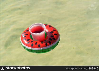 Inflatable water melon slice with cocktail drink