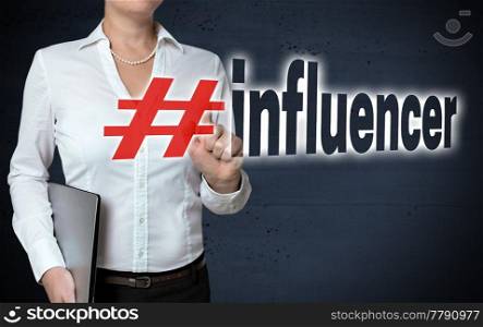 Influencer touchscreen is shown by businesswoman.. Influencer touchscreen is shown by businesswoman