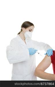 Influenza shot being injected by a nurse wearing a mask