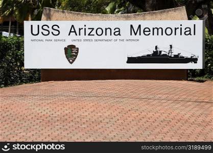Information board in front of a tree, USS Arizona Memorial, Pearl Harbor, Honolulu, Oahu, Hawaii Islands, USA