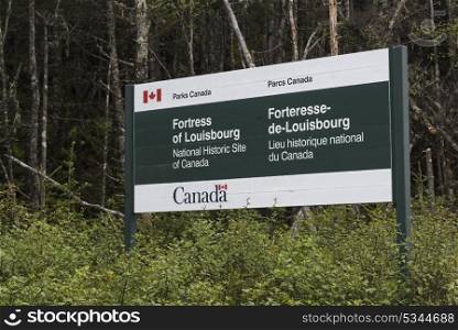 Information sign in forest, Fortress of Louisbourg, Louisbourg, Cape Breton Island, Nova Scotia, Canada