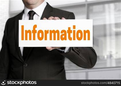 Information sign is held by businessman concept. Information sign is held by businessman concept.