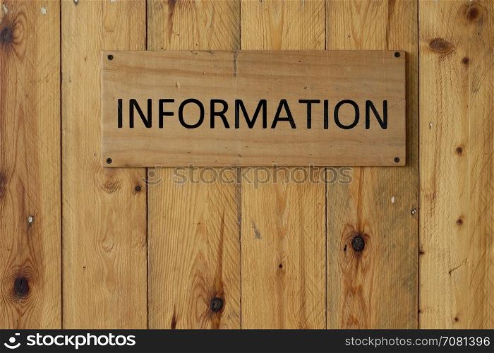 information sign on wooden background