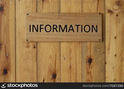 information sign on wooden background