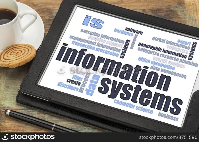 information systems word cloud on a digital tablet with a cup of coffee