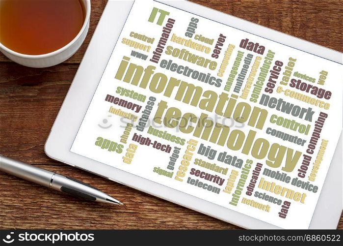 information technology word cloud on a digital tablet with a cup of tea
