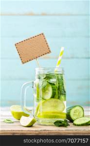 infused detox water with cucumber, lime and mint for diet healthy eating and weight loss with blank space for your text