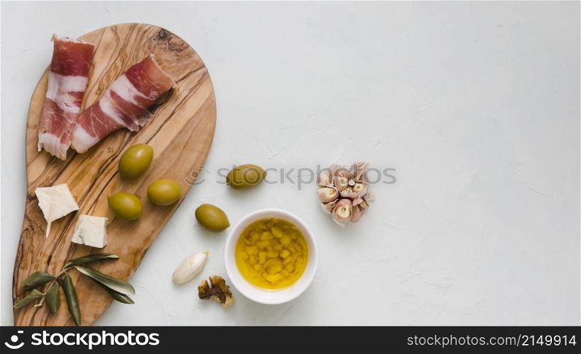 infused olive oil olives garlic club cheese bacon isolated white backdrop