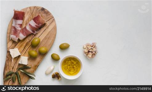 infused olive oil olives garlic club cheese bacon isolated white backdrop