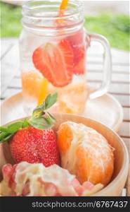 Infused water mug of mix fruit refreshing drink, stock photo