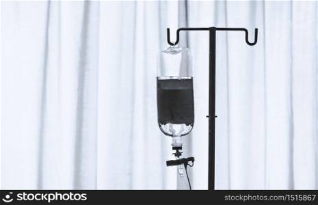 infusion bottle with white curtain background