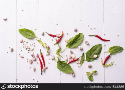 Ingredient of spices vegetables on white wood table