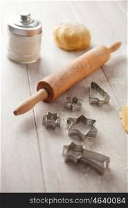Ingredients and utensils to cook cookies?s Christmas on gray wood board