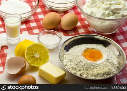 Ingredients for a cake - flour, butter, eggs, baking powder, sugar
