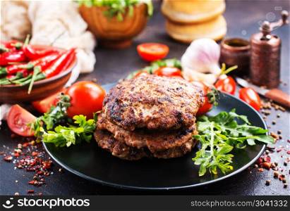 ingredients for burgers. Products for preparation of burgers: buns, tomatoes, sauce, cutlets