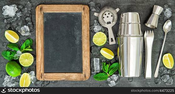 Ingredients for cocktail drink. Lime and mint leaves. Chalkboard for Your recipe text