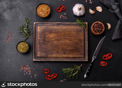 Ingredients for cooking at home  pepper, salt, rosemary, spices and herbs on a dark concrete background. Ingredients for cooking at home  pepper, salt, rosemary, spices and herbs