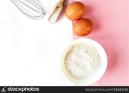 Ingredients for cooking baking - flour, egg, sugar, rolling pin on pink background. Concept of cooking dessert and sweet food.. Ingredients for cooking baking - flour, egg, sugar, rolling pin on pink background. Concept of cooking dessert.
