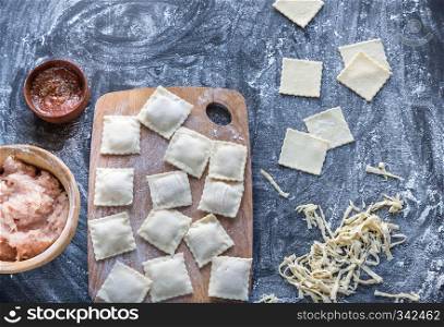 Ingredients for cooking ravioli on the wooden board