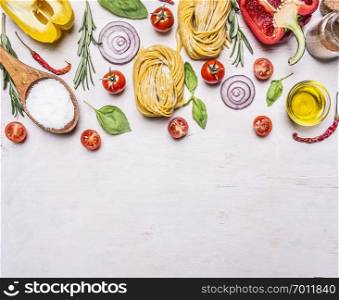 Ingredients for cooking vegetarian pasta with tomatoes, basil, oil, pepper on wooden rustic background top view border ,place for text