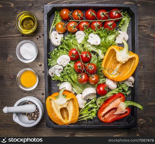 Ingredients for cooking vegetarian salad assortment of farm fresh vegetables in a wooden box on wooden rustic background top view close up