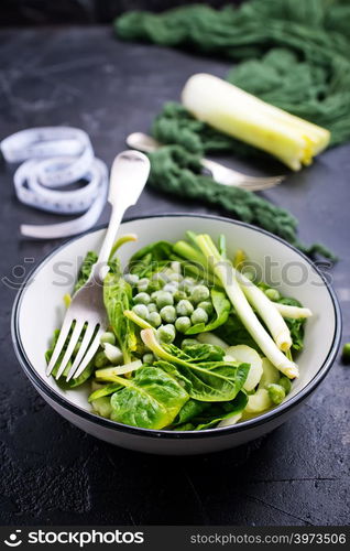 ingredients for diet salad in bowl on a table