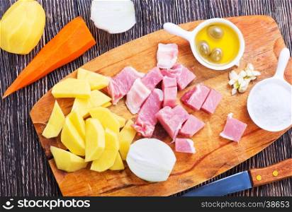 ingredients for dinner on wooden board andf on a table