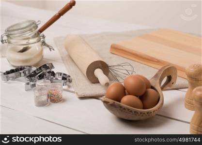 Ingredients for dough on white wooden table