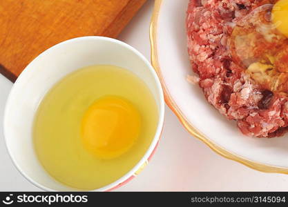 Ingredients for homemade cutlet, ground beef and eggs