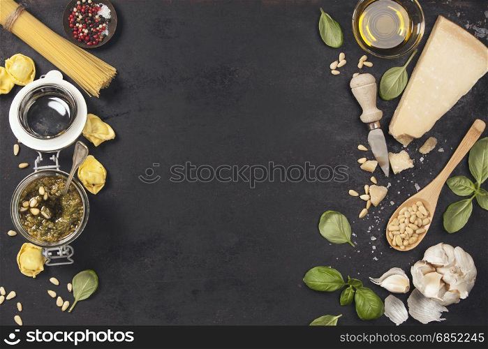 Ingredients for italian pesto sauce on rustic background