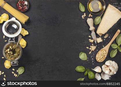 Ingredients for italian pesto sauce on rustic background