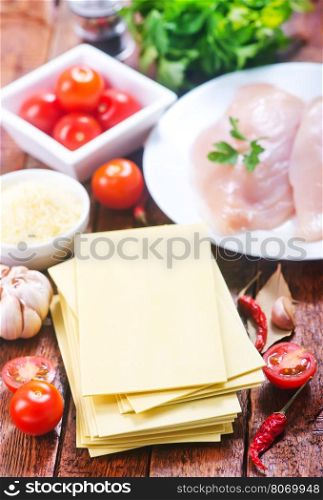 ingredients for lasagna on the wooden table