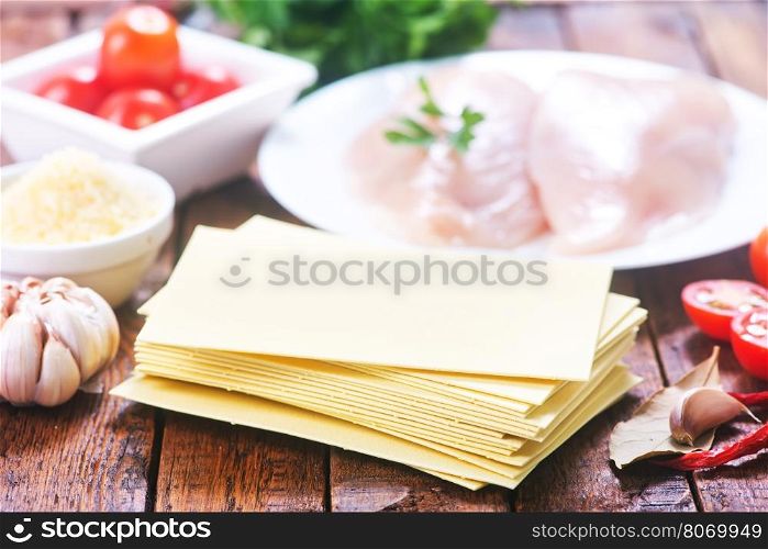 ingredients for lasagna on the wooden table